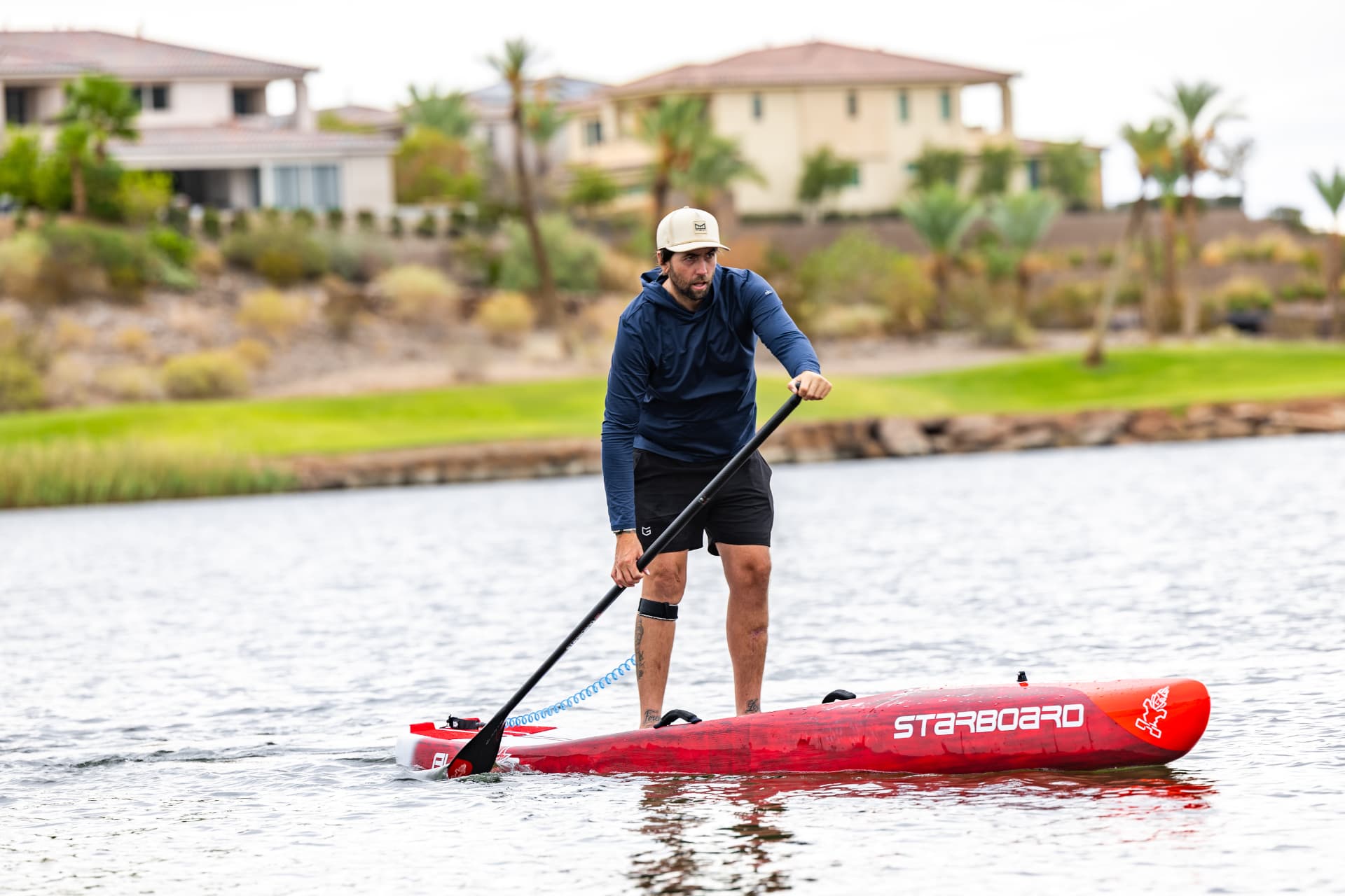 Josh Metz paddling a Starboard board on Lake Las Vegas